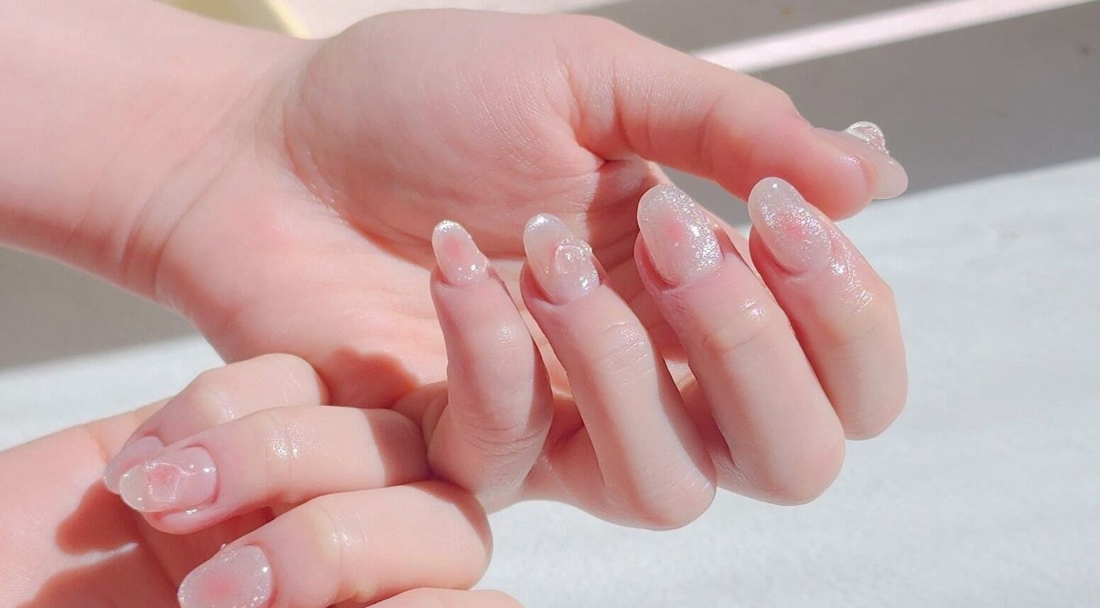 Elegant glitter nails at Wonderbu Nails, Melbourne, Victoria, AU, showcasing delicate artistry and shine.