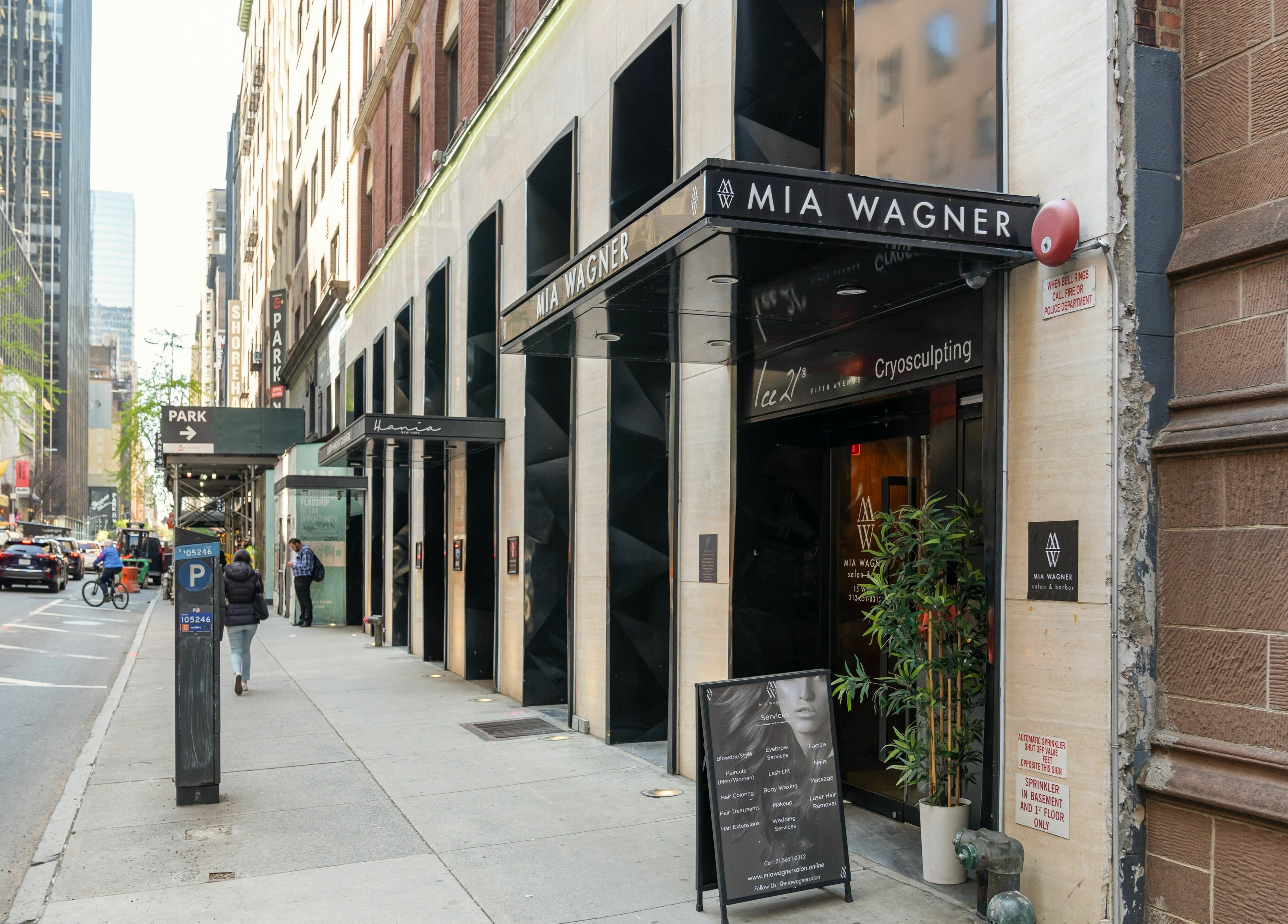 Street view of W Laser Inc, New York, New York, with modern facade and signage.