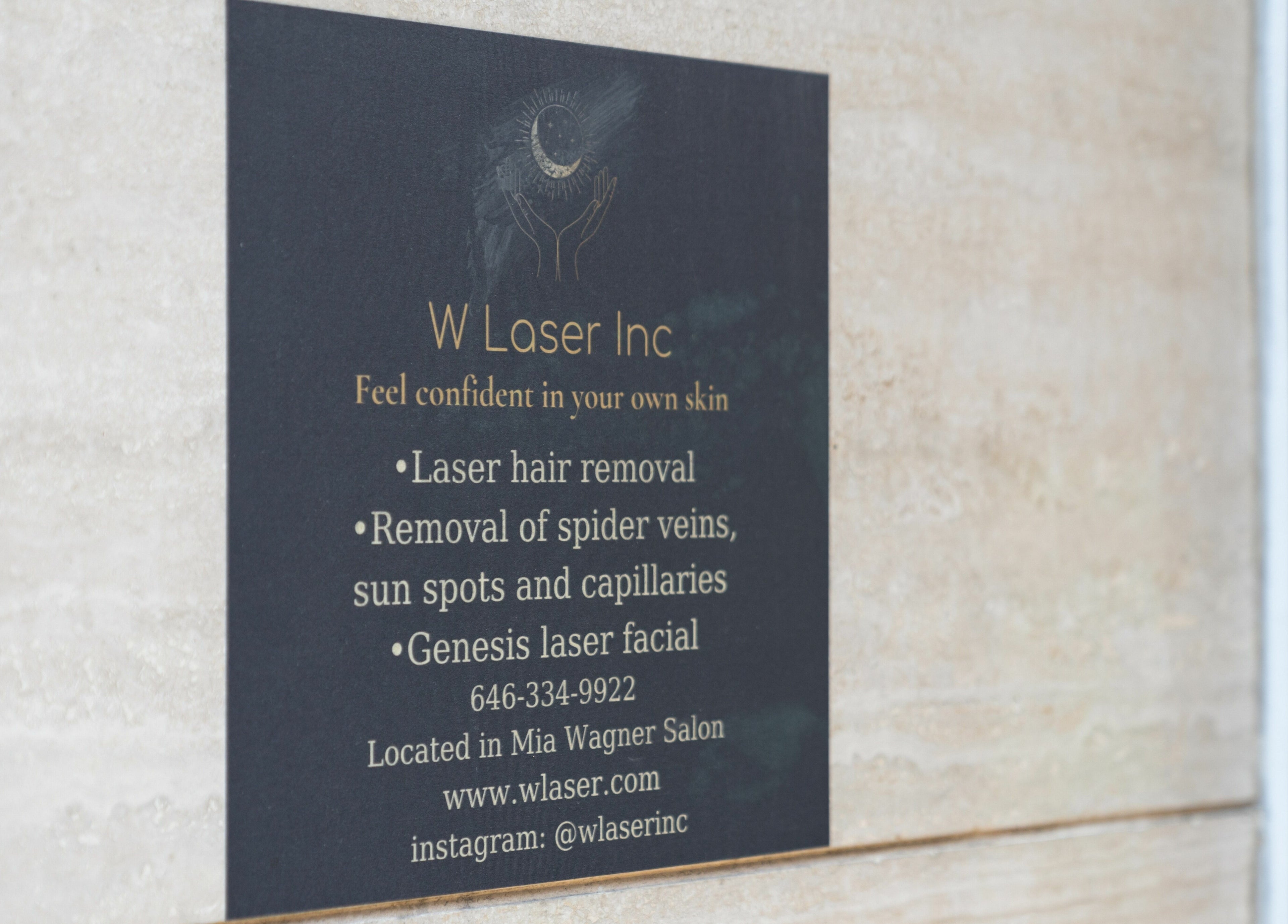 W Laser Inc sign detailing beauty services in New York, New York, US.