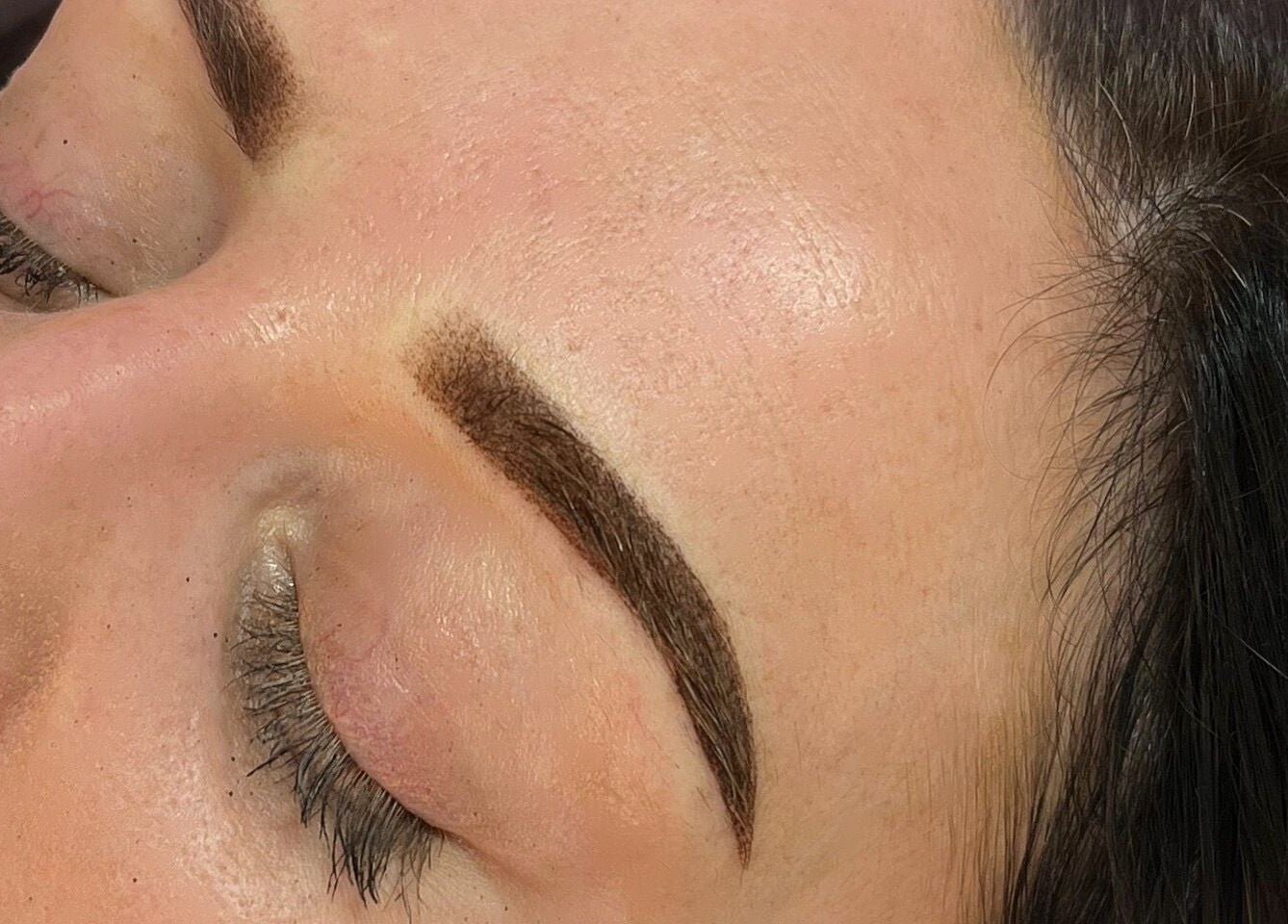 Close-up of expertly shaped eyebrows at Darlalash, Kettering, England, GB.
