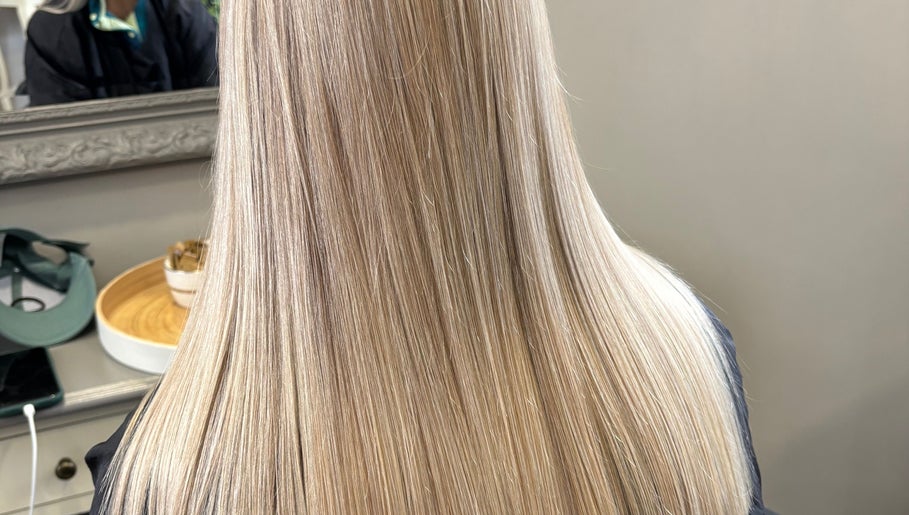 Smooth blonde hair at Poison Ivy Hair By Brooke in Windermere, England, GB, showcasing expert styling.