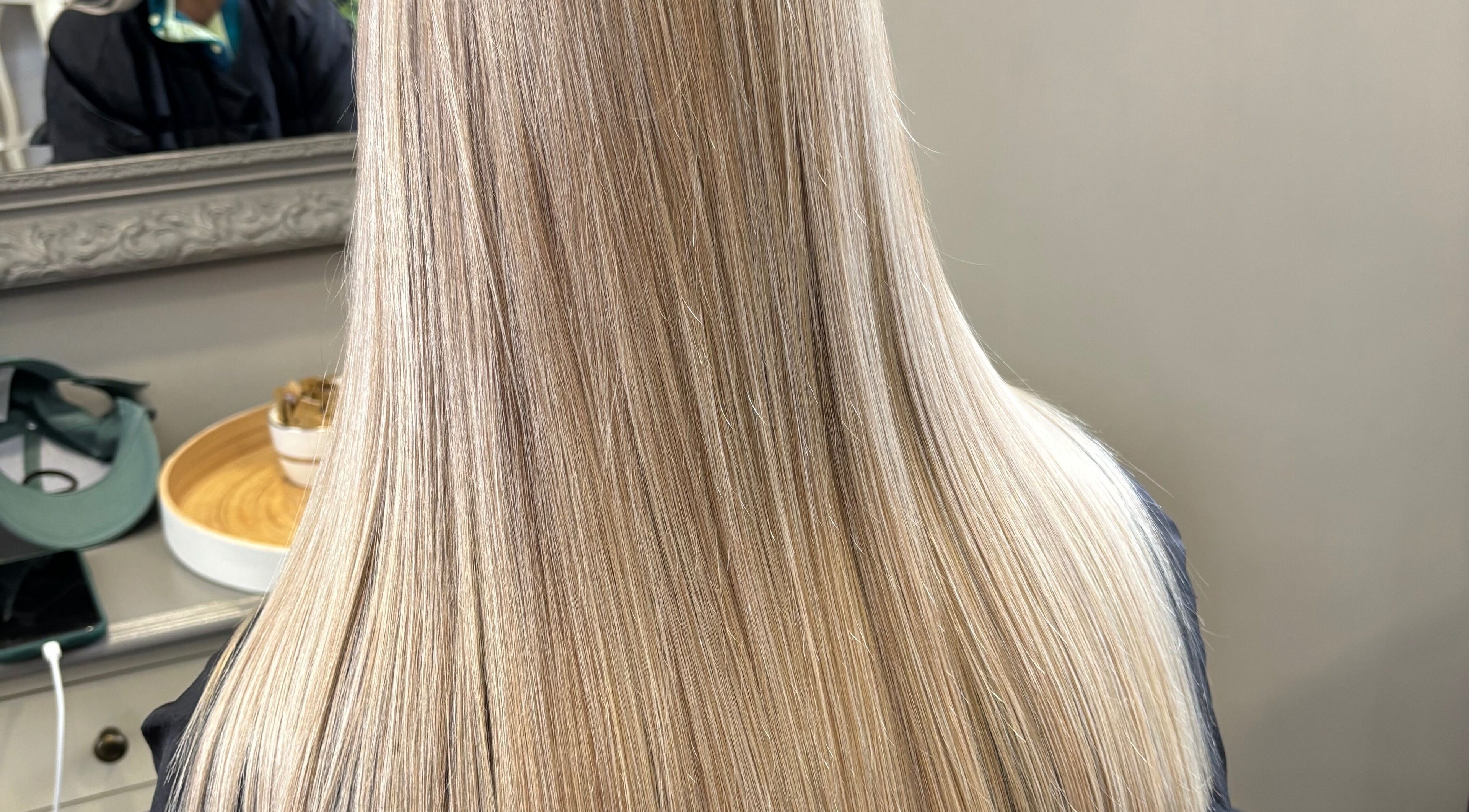 Sleek blonde hair transformation at Poison Ivy Hair By Brooke, Windermere, England, GB. Elegant salon styling.