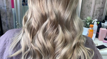 Blonde wavy hair styled at Hair by Emma in Motherwell, Scotland, GB. Elegant salon look for modern styles.