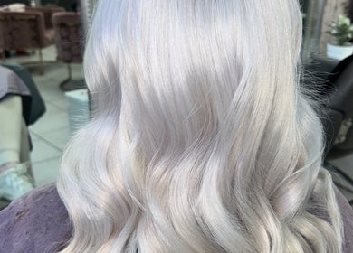 Beautiful silvery blonde hair styled at Hair by Emma in Motherwell, Scotland, GB. A chic salon experience.