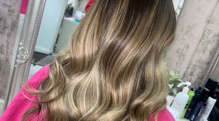 Elegant, wavy hairstyle at Hair by Emma, Motherwell, Scotland, GB showcased in a chic salon setting.