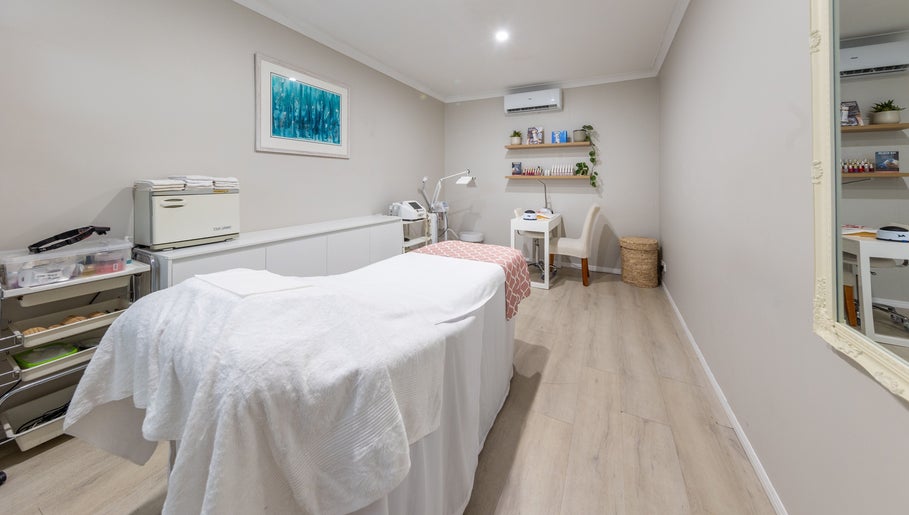 Cozy treatment room at Justine's Accent on Beauty in Mudgeeraba, Queensland, AU, featuring a massage table.