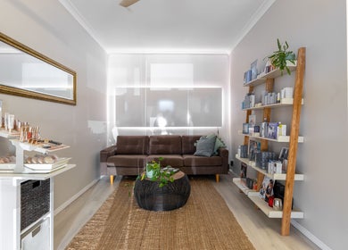 Cozy lounge at Justine's Accent on Beauty, Mudgeeraba, Queensland, AU, showcasing a chic aesthetic.