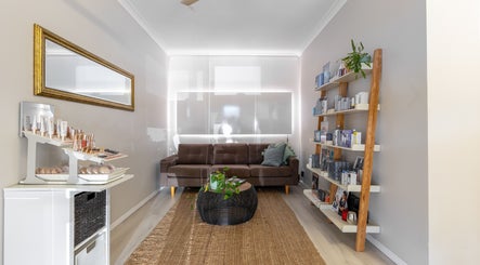 Cozy lounge at Justine's Accent on Beauty, Mudgeeraba, Queensland, AU, showcasing a chic aesthetic.