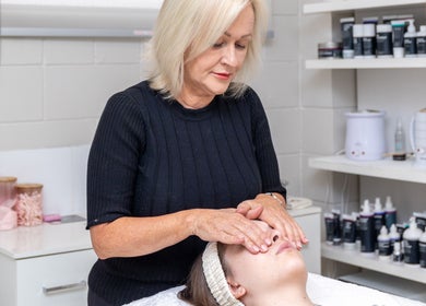 Therapist performing a relaxing facial at Justine's Accent on Beauty, Mudgeeraba, Queensland, AU.