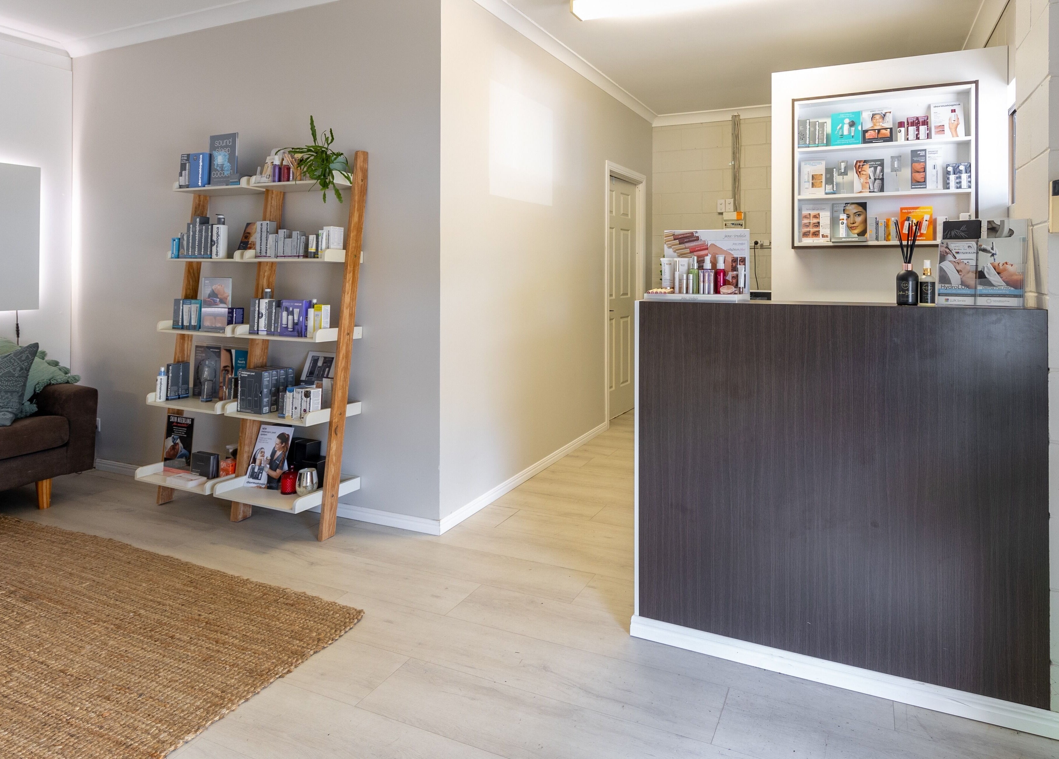 Reception at Justine's Accent on Beauty in Mudgeeraba, Queensland, AU with shelves of beauty products.