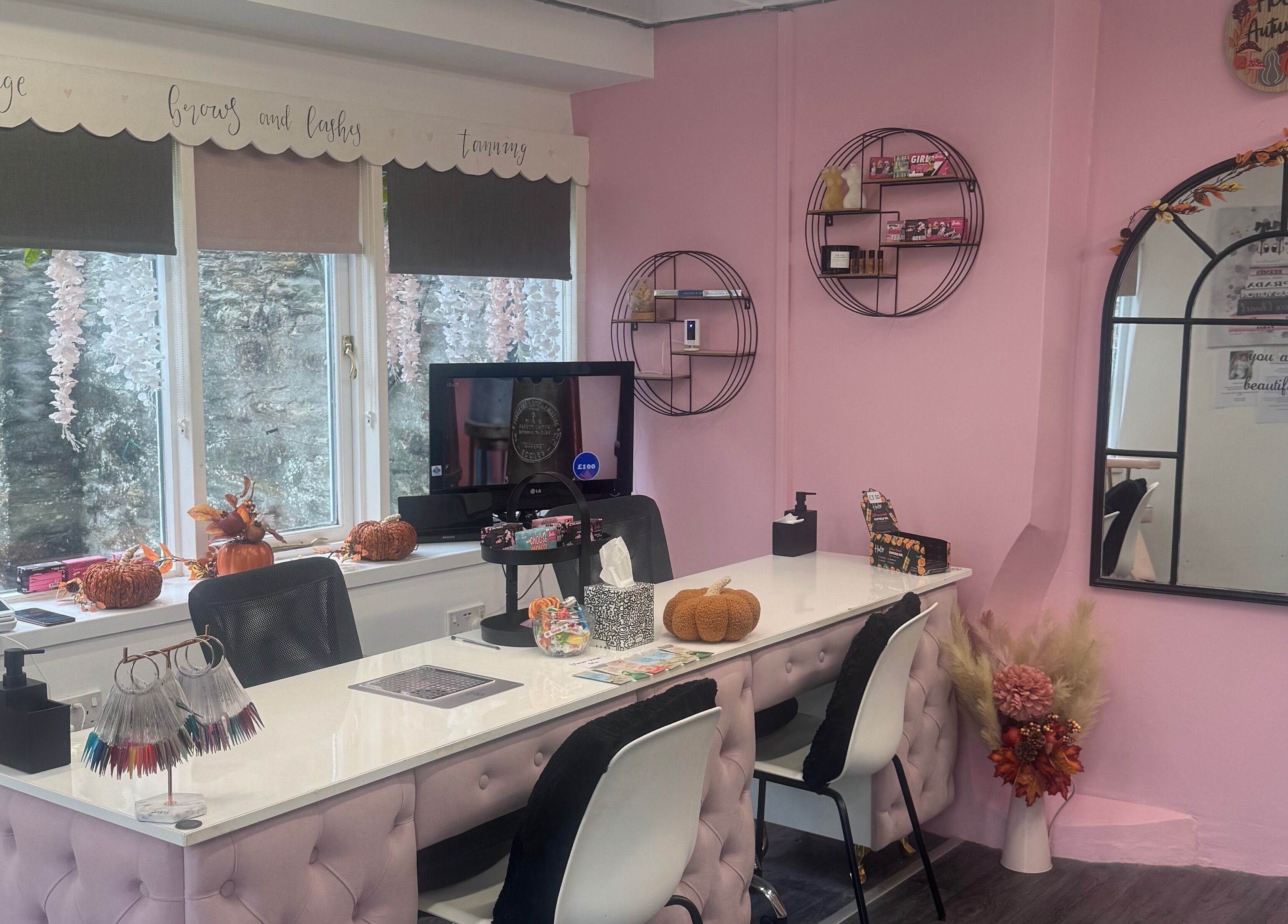 Chlos Beauty Corner nail bar with pink decor and elegant setup in Callington, England, GB.
