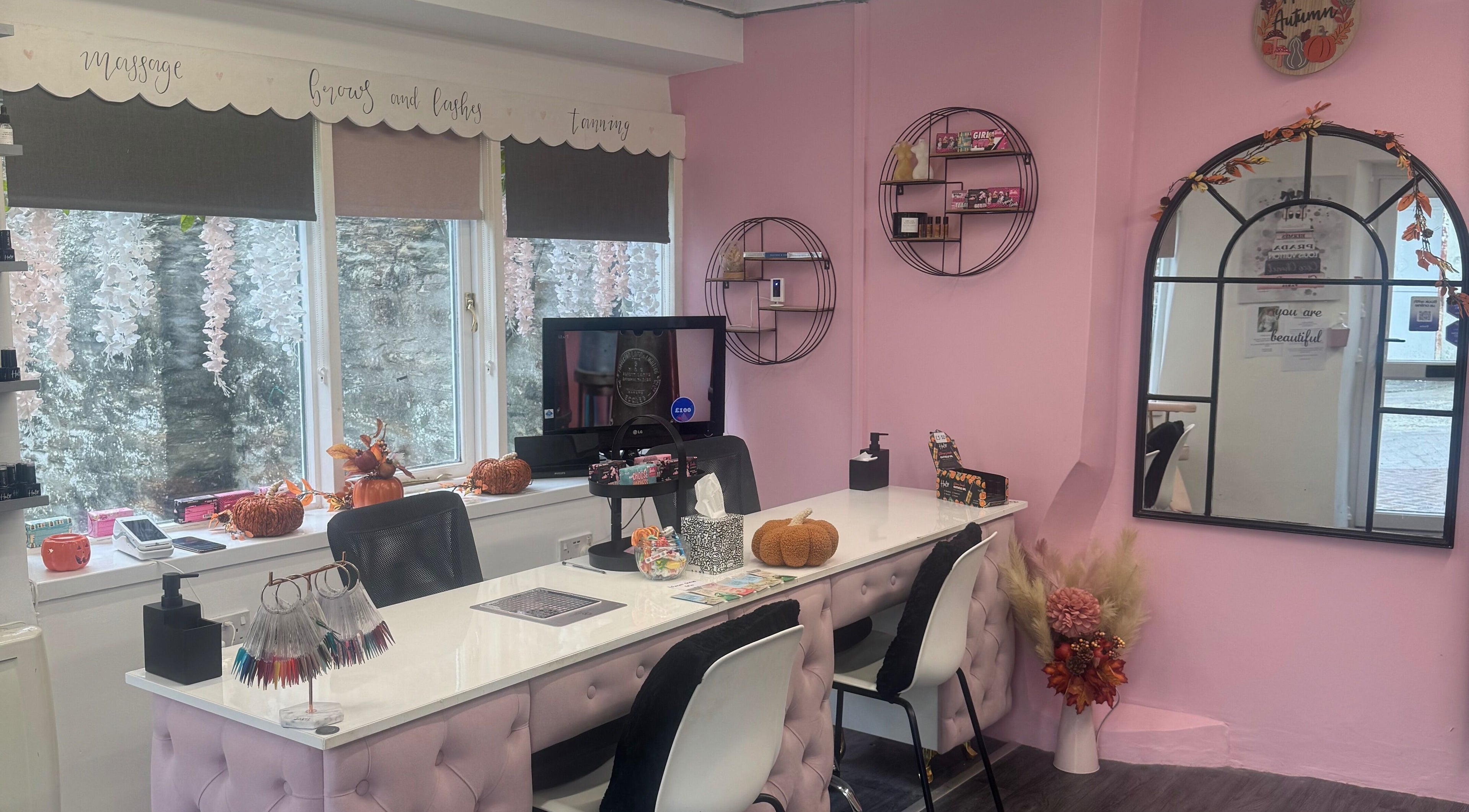 Chlos Beauty Corner nail bar with pink decor and elegant setup in Callington, England, GB.