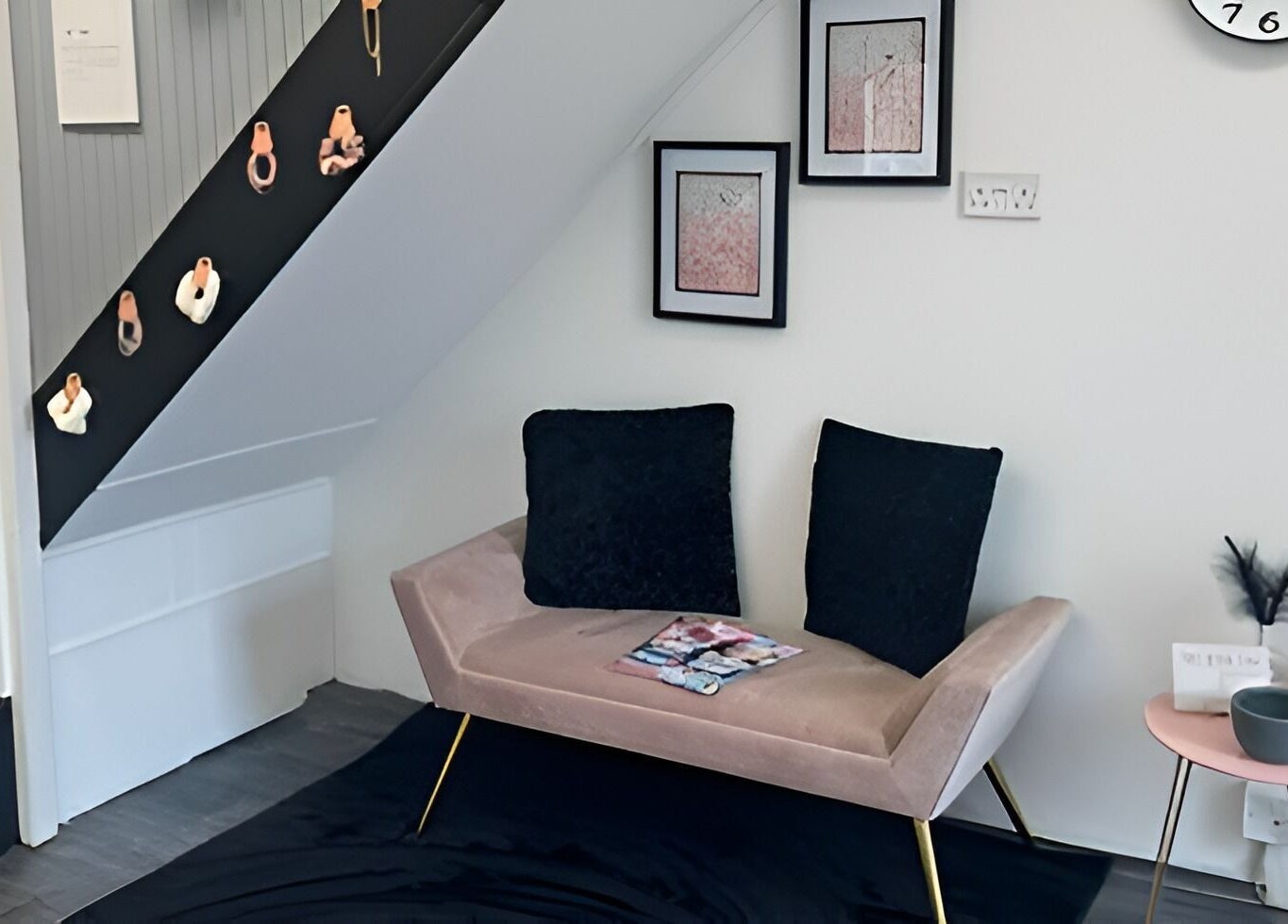 Elegant seating area at Chlos Beauty Corner, Callington, England, GB features a plush sofa and decor.