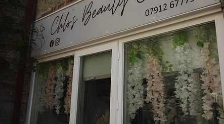Chlos Beauty Corner entrance with floral decor in Callington, England, GB.