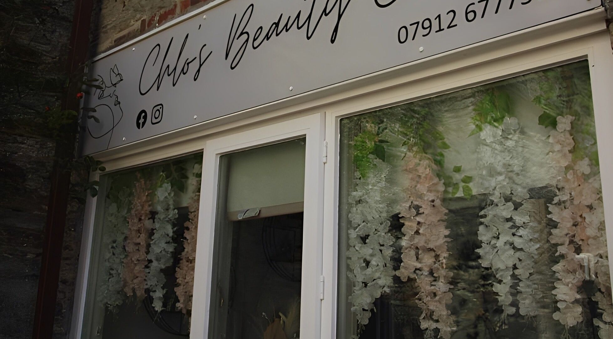 Chlos Beauty Corner entrance with floral decor in Callington, England, GB.