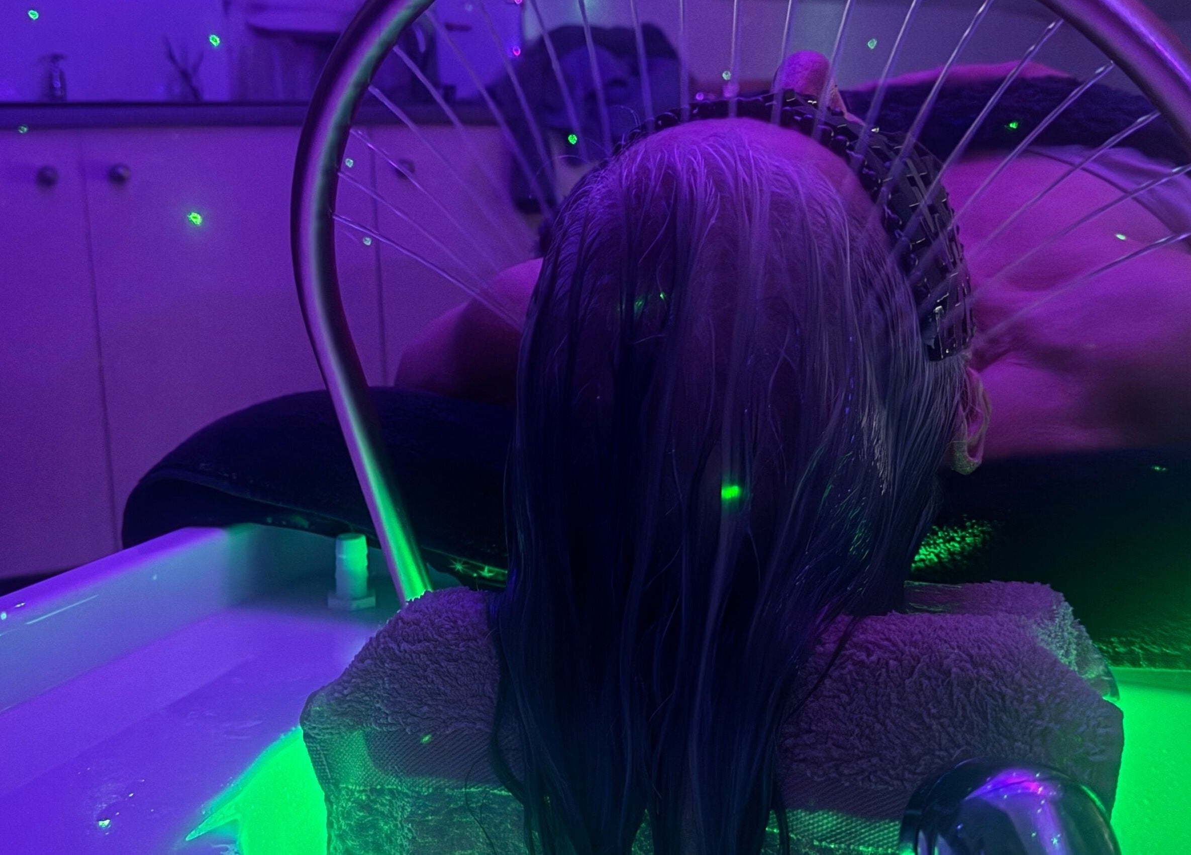 Relaxing hair wash session at Chlos Beauty Corner, Callington, England, GB under soothing lights.