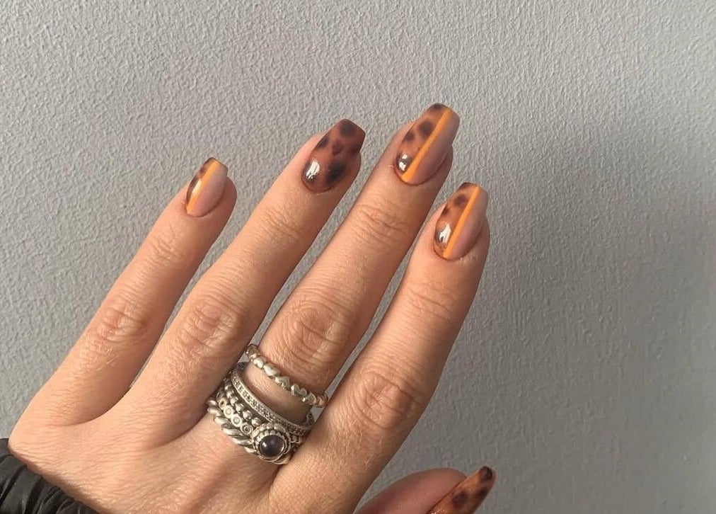 Stylish tortoiseshell nail art at Chlos Beauty Corner, Callington, England, GB.