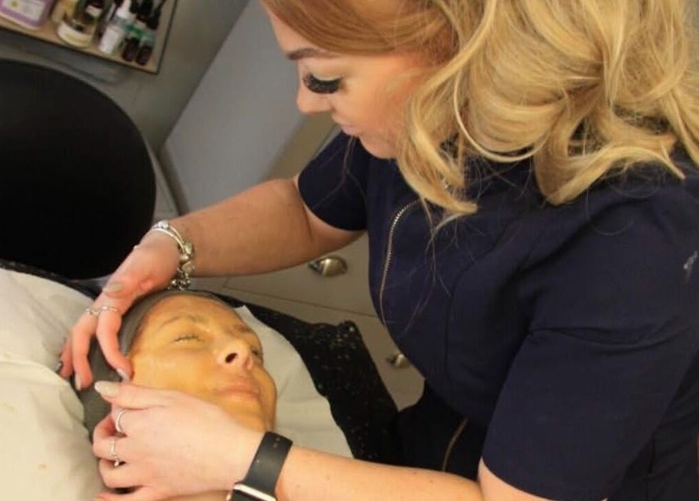 Expert facial treatment at Chlos Beauty Corner in Callington, England, GB. Aesthetician enhances skin's radiance.