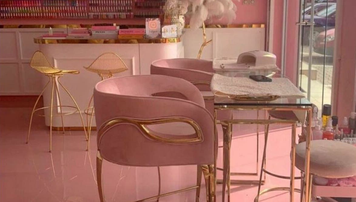 Elegant pink and gold interior of Lynette's beauty studio in Accra, Greater Accra Region, GH.