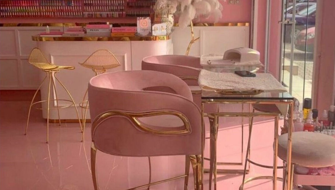 Elegant pink and gold interior of Lynette's beauty studio in Accra, Greater Accra Region, GH.