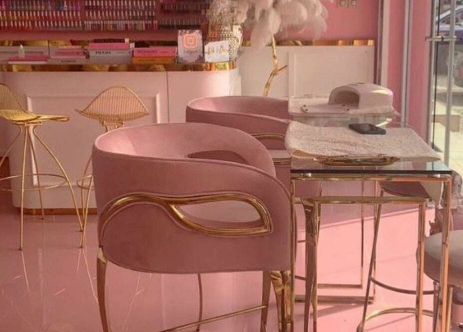 Elegant pink and gold interior of Lynette's beauty studio in Accra, Greater Accra Region, GH.