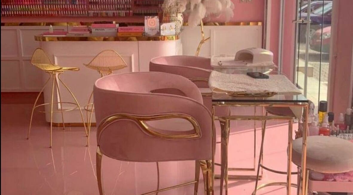 Elegant pink and gold interior of Lynette's beauty studio in Accra, Greater Accra Region, GH.