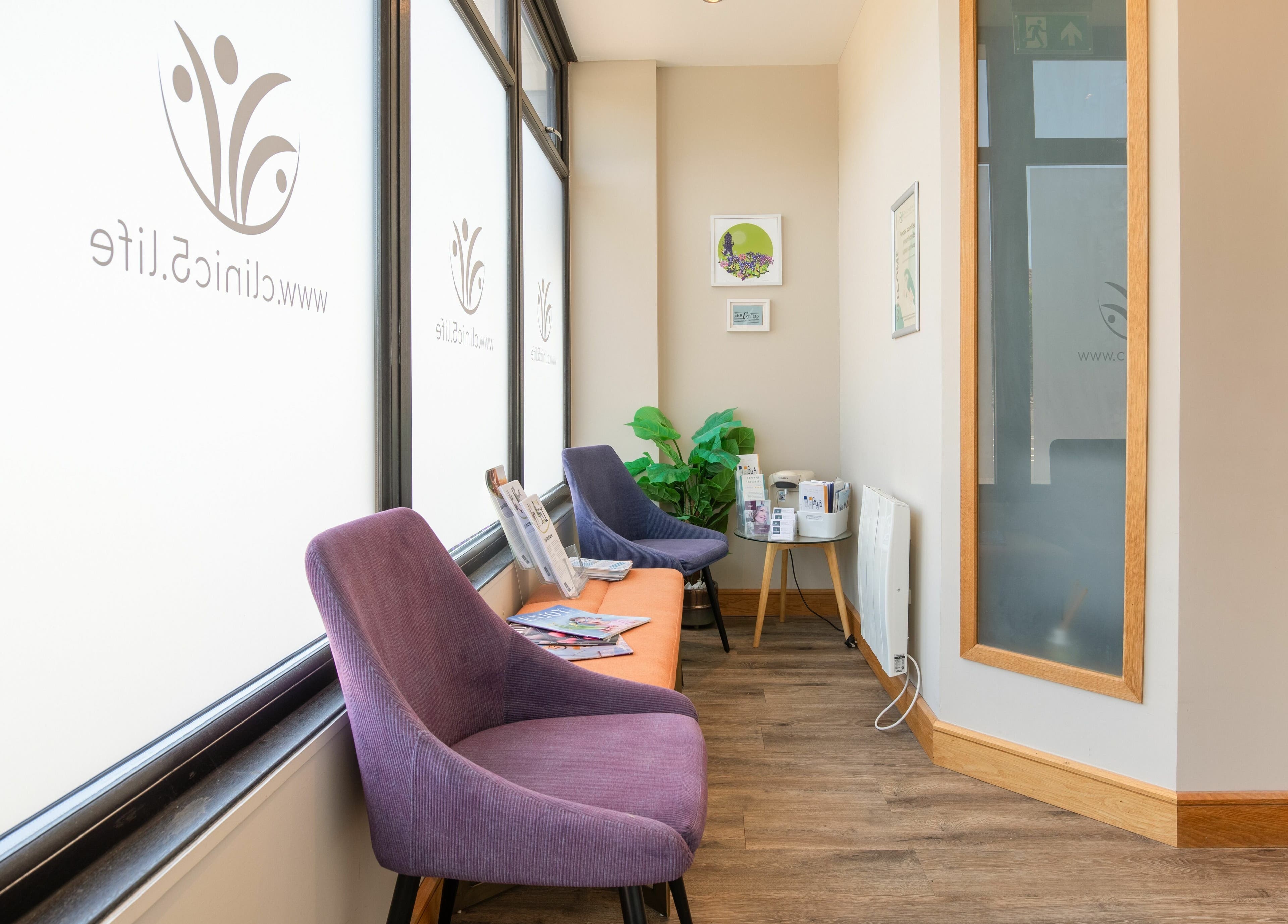 Relaxing lounge area at Frontalis Clinic, Portishead, England, GB with stylish chairs and decor.