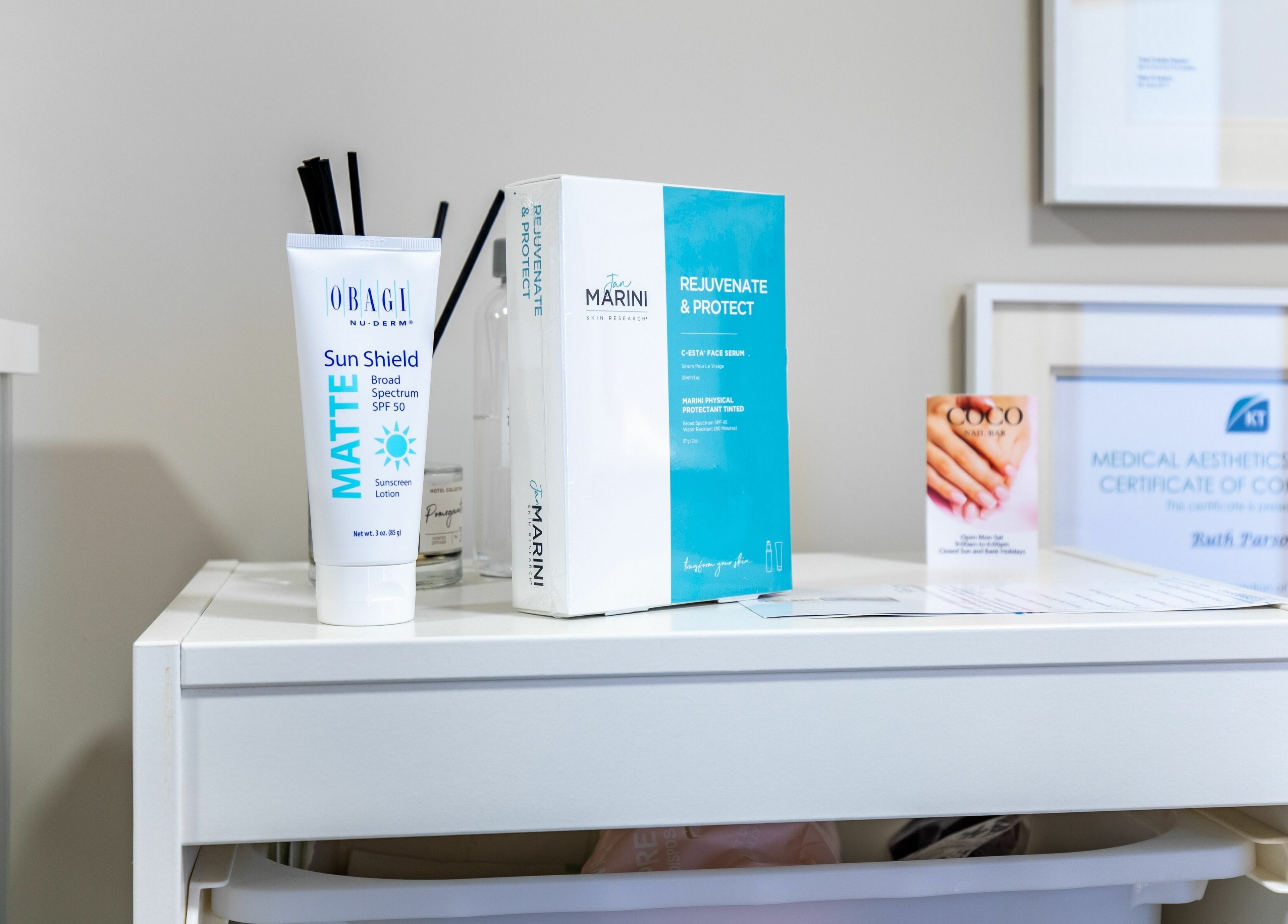 Beauty products on a shelf at Frontalis Clinic, Portishead, England, GB, showcasing skincare essentials.