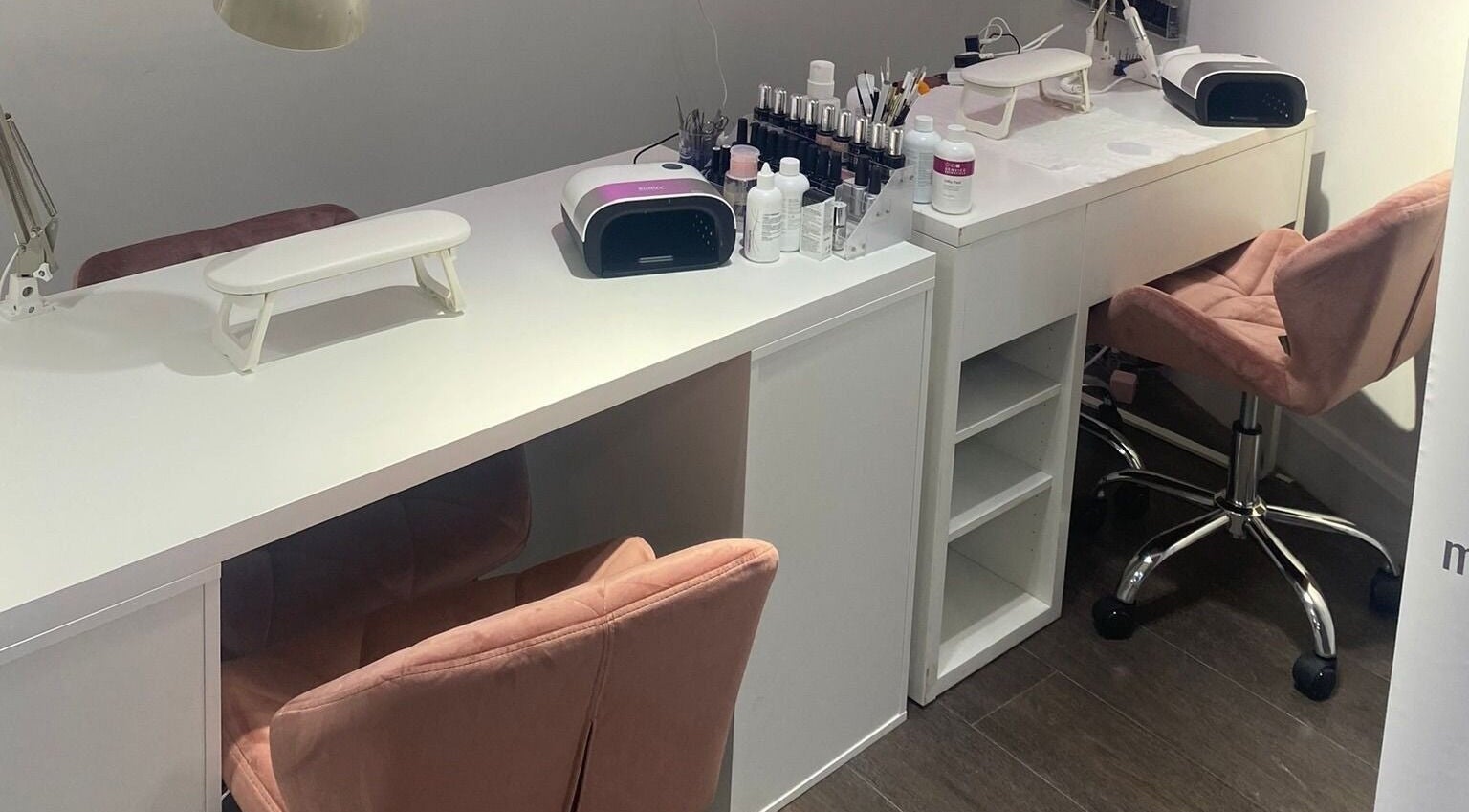 Chic nail station at MWM Beauty, County Mayo, IE, with modern tools and plush seating.