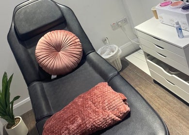 Relaxing treatment chair in MWM Beauty, County Mayo, IE, adorned with plush cushion and soft blanket.