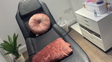 Relaxing treatment chair in MWM Beauty, County Mayo, IE, adorned with plush cushion and soft blanket.