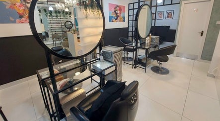 Elegant styling stations at Polish Nails Care & More Salon in Abu Dhabi, AE showcasing modern design.