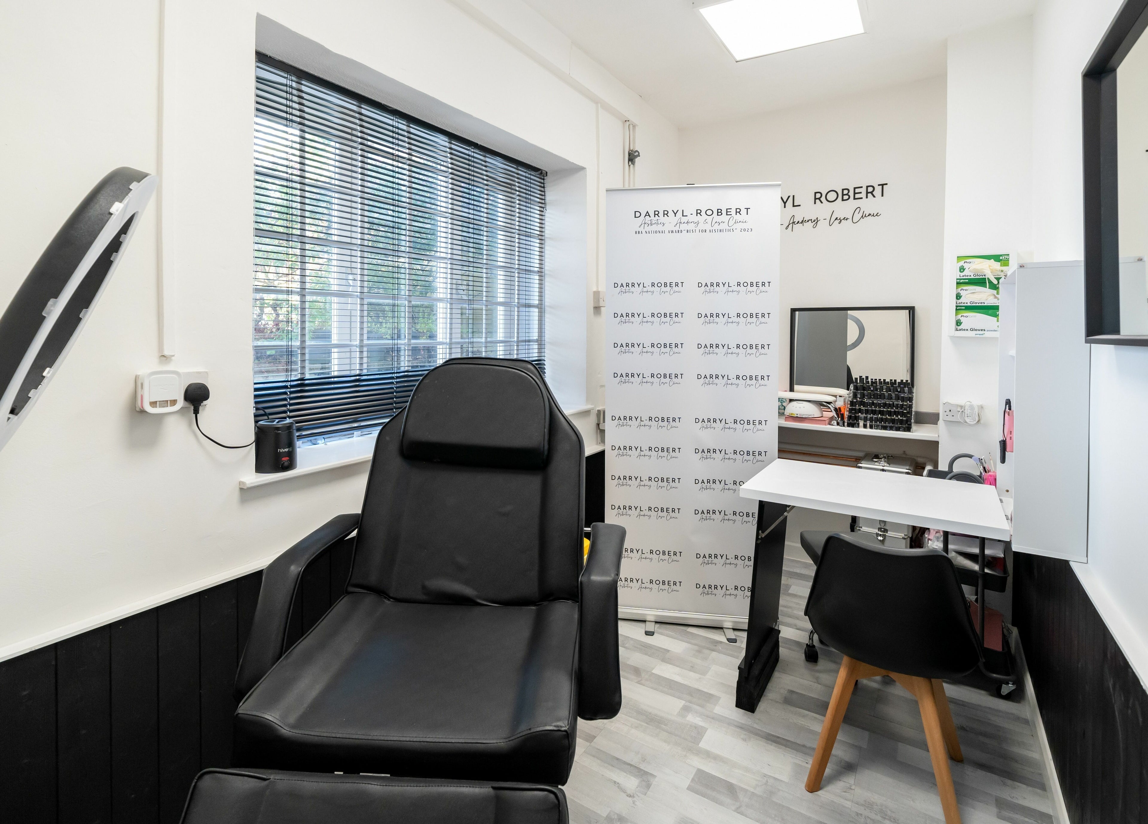 Modern treatment room at DRA Honiton HQ, Honiton, England, GB, featuring stylish decor and comfortable seating.