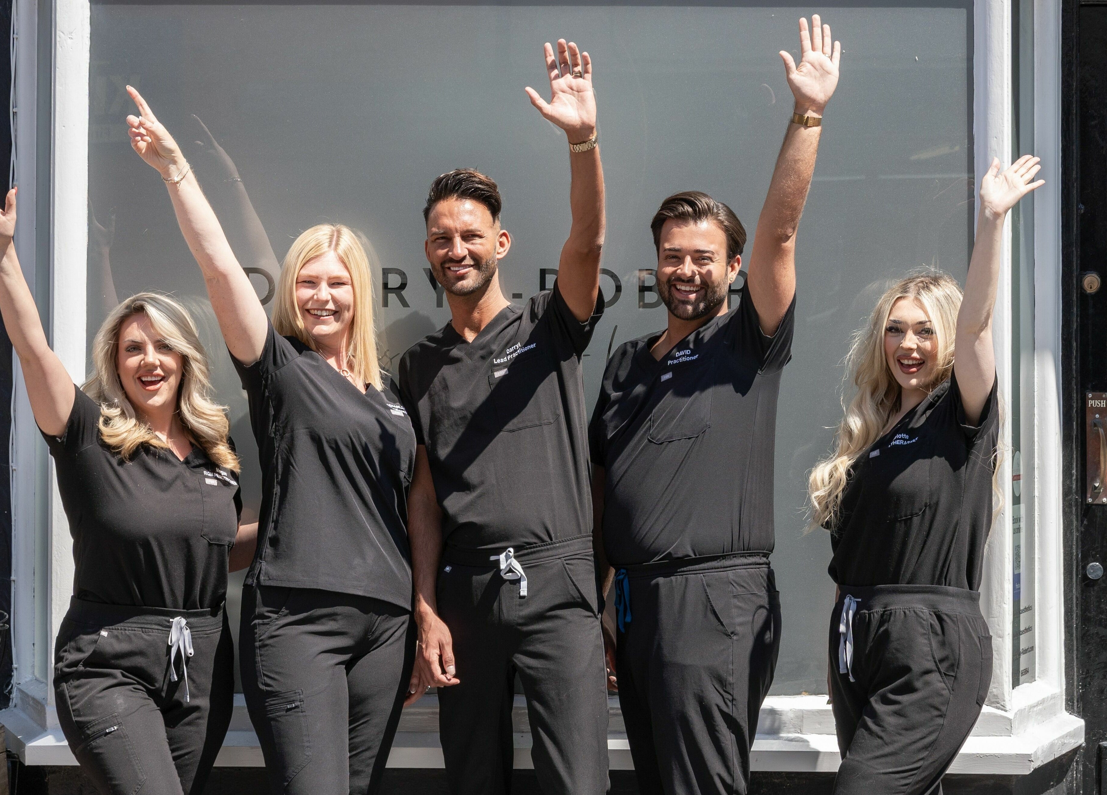 Team celebrating outside DRA Honiton HQ in Honiton, England, GB.