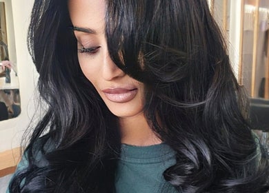 Woman with styled black hair at Allure Hair and Co - By Christina in Coburg, Victoria, AU.