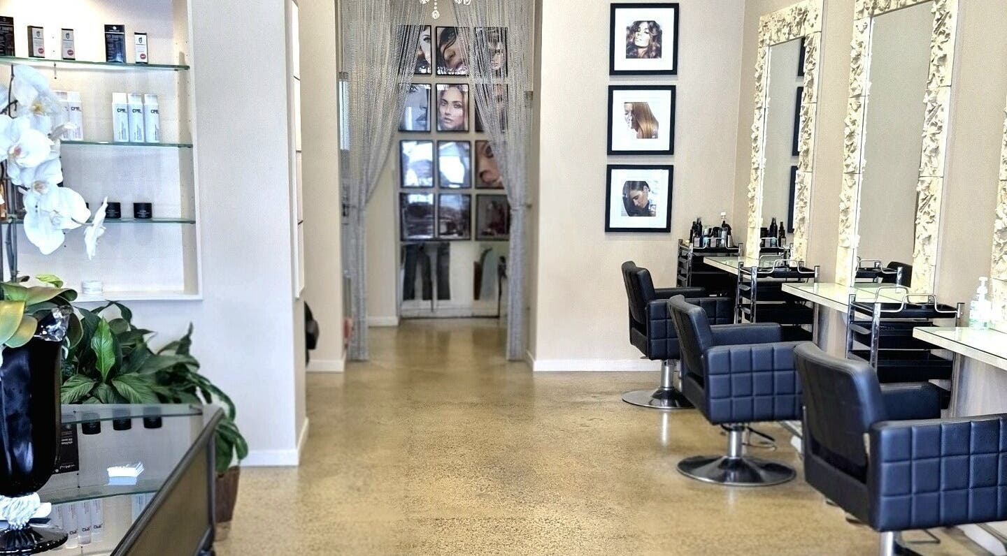 Elegant interior of Allure Hair and Co in Coburg, Victoria, AU featuring stylish salon chairs and decor.