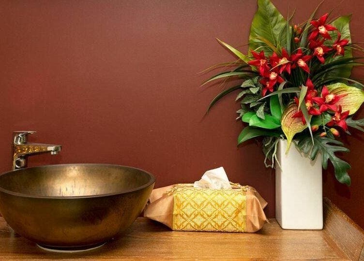 Elegant brass sink with floral decor at Serenergy Thai Massage Centre, Armadale, Victoria, AU.