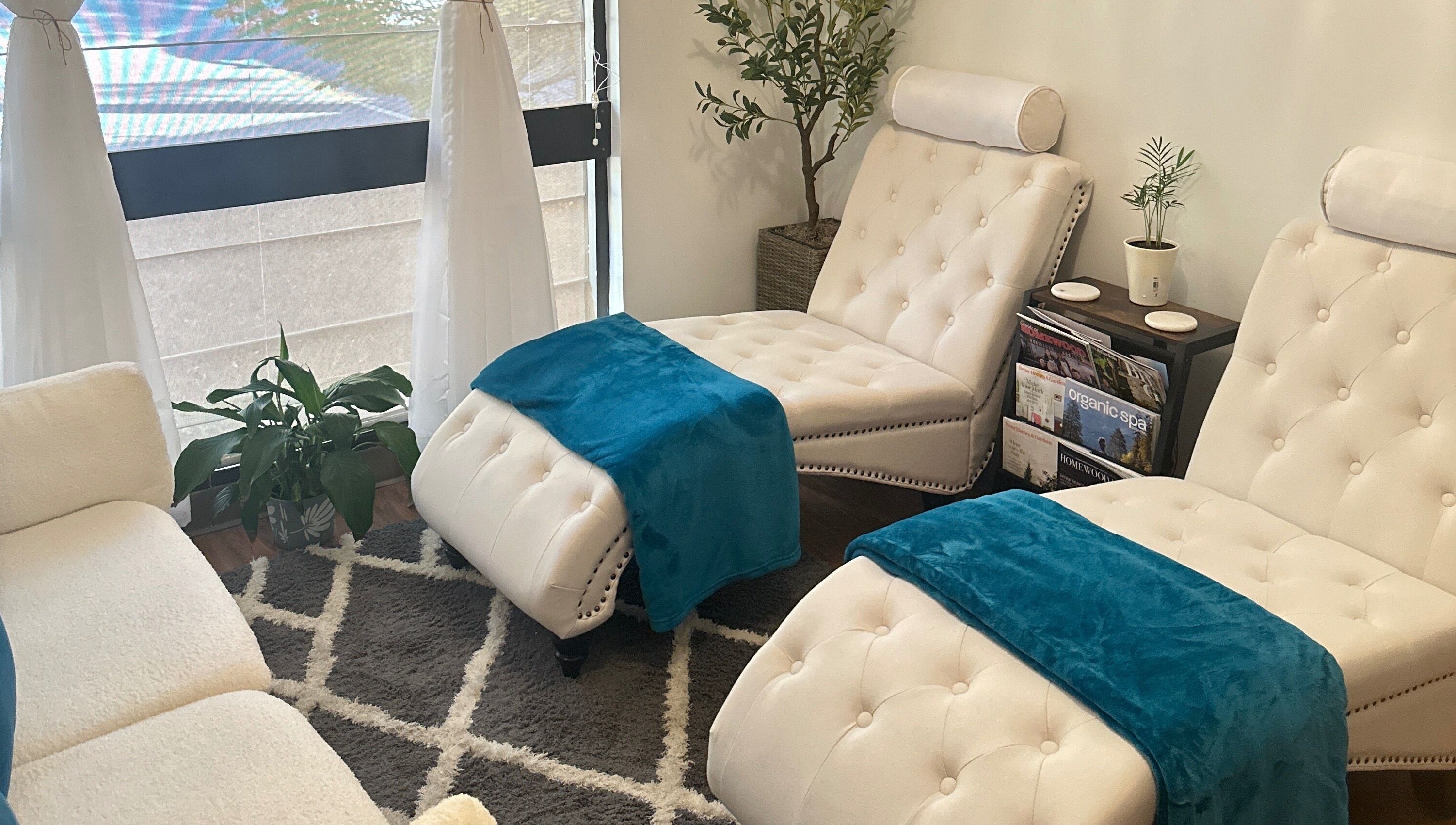 Cozy massage chairs at Aphros Beauty, Homewood, Alabama, US offering a serene wellness experience.