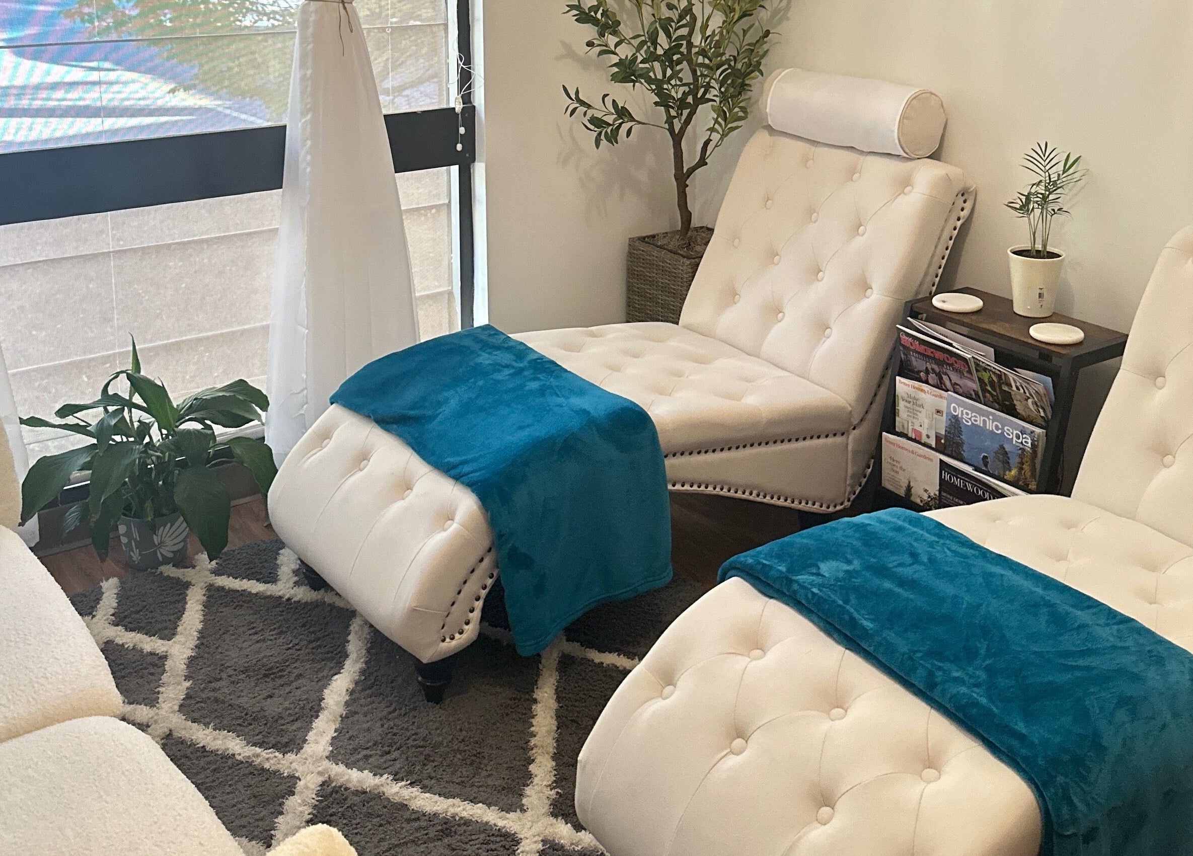 Cozy massage chairs at Aphros Beauty, Homewood, Alabama, US offering a serene wellness experience.