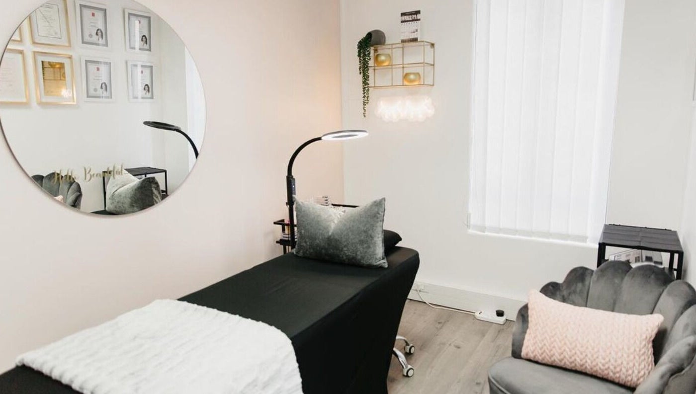 Relaxing treatment room at The Brow Specialist, Somerset West, Western Cape, ZA, showcasing elegant decor.