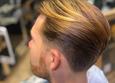 Close-up of a stylish men's haircut at The LadyBarber’s Shop, New Bradwell, England, GB.
