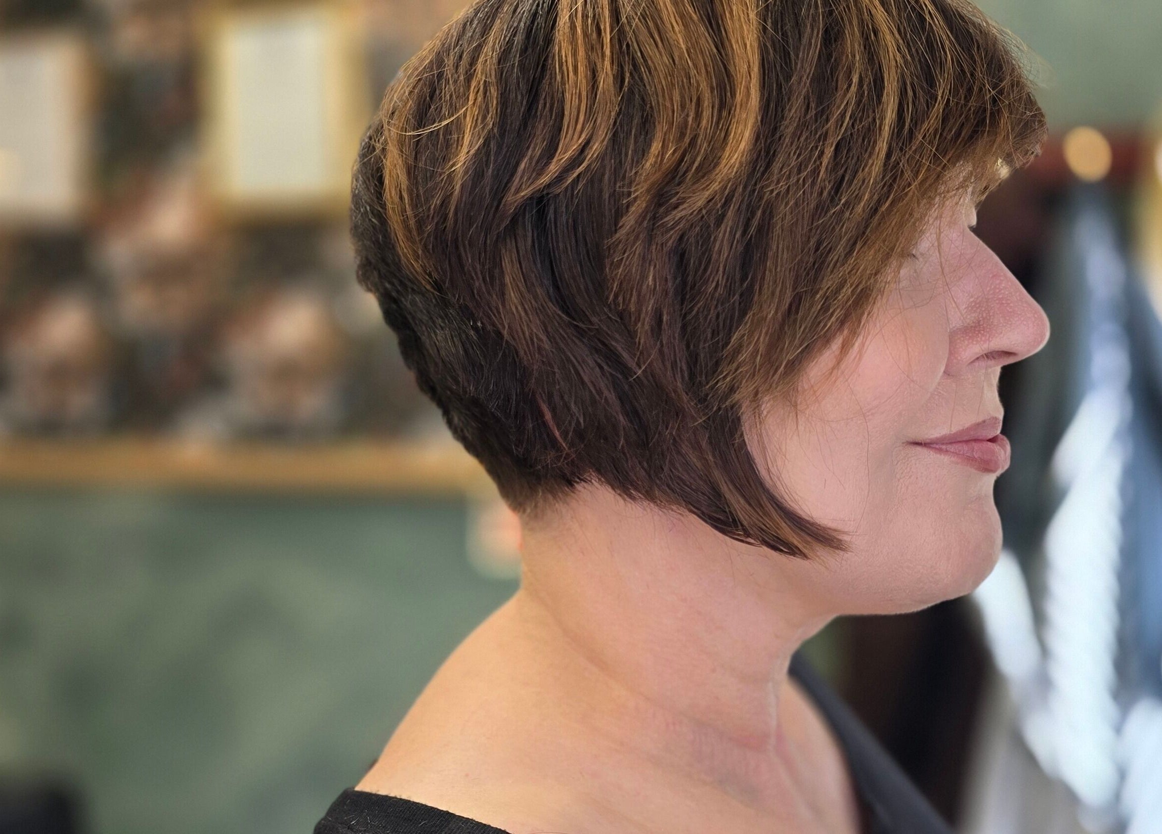 Side view of a chic bob hairstyle at The LadyBarber’s Shop, New Bradwell, England, GB.