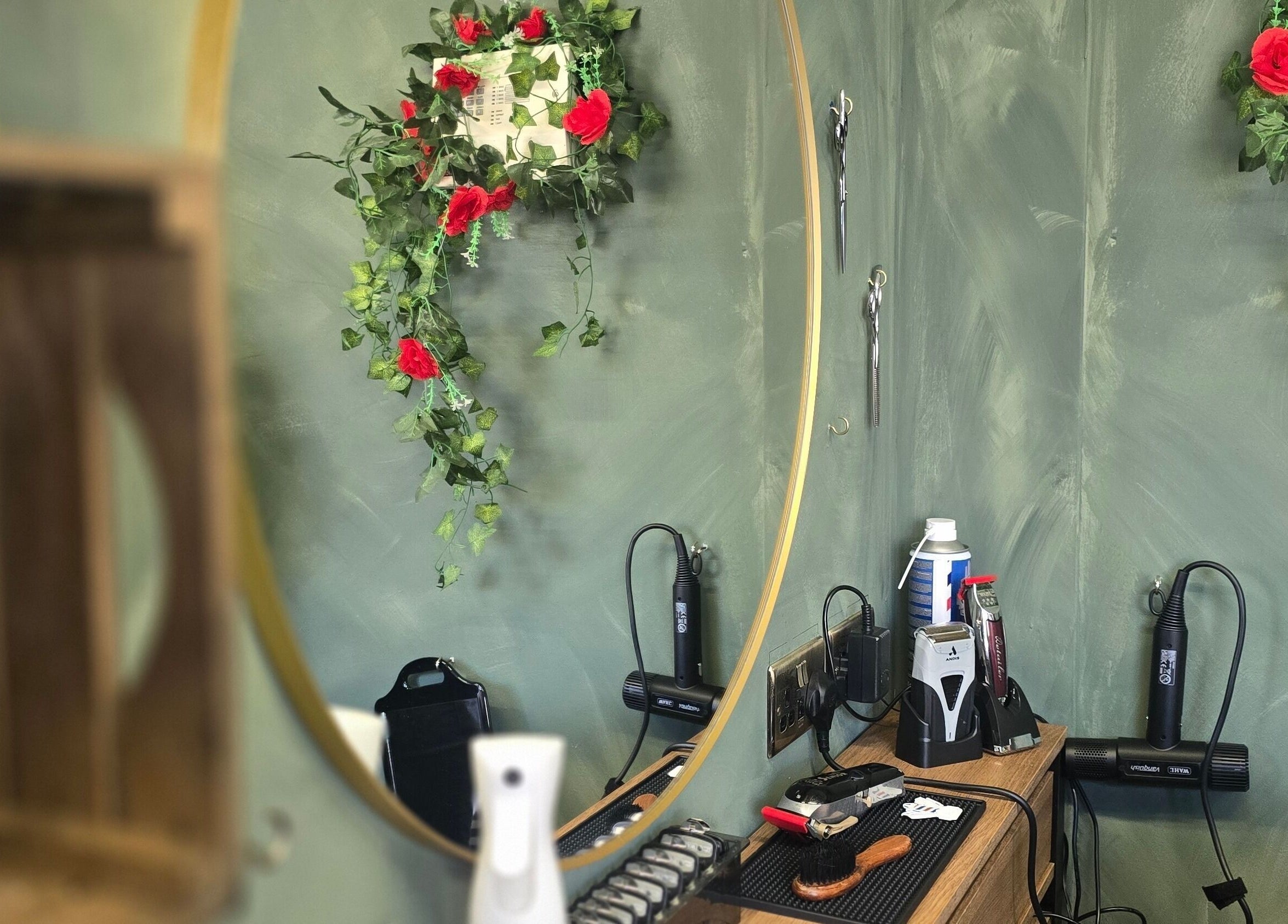 Chic barber station at The LadyBarber’s Shop, New Bradwell, England, GB. Elegant decor with tools and mirror.