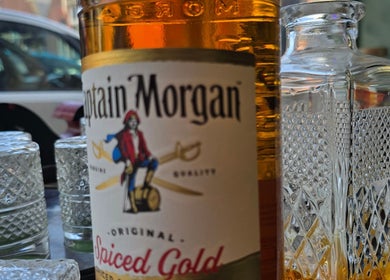 Captain Morgan bottle at The LadyBarber's Shop, New Bradwell, England. Sleek design for stunning ambiance.