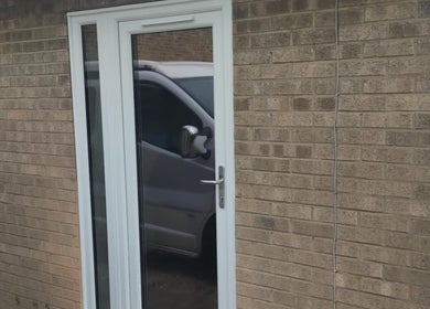 Entrance to Beauty by Bex Treatment Room, March, England, GB, featuring a sleek glass door.