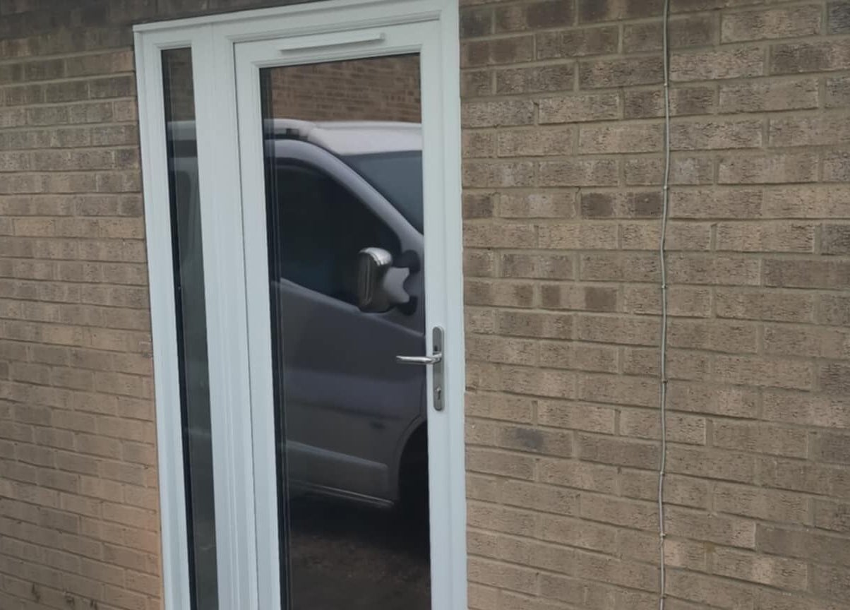 Entrance to Beauty by Bex Treatment Room, March, England, GB, showcasing a modern glass door.