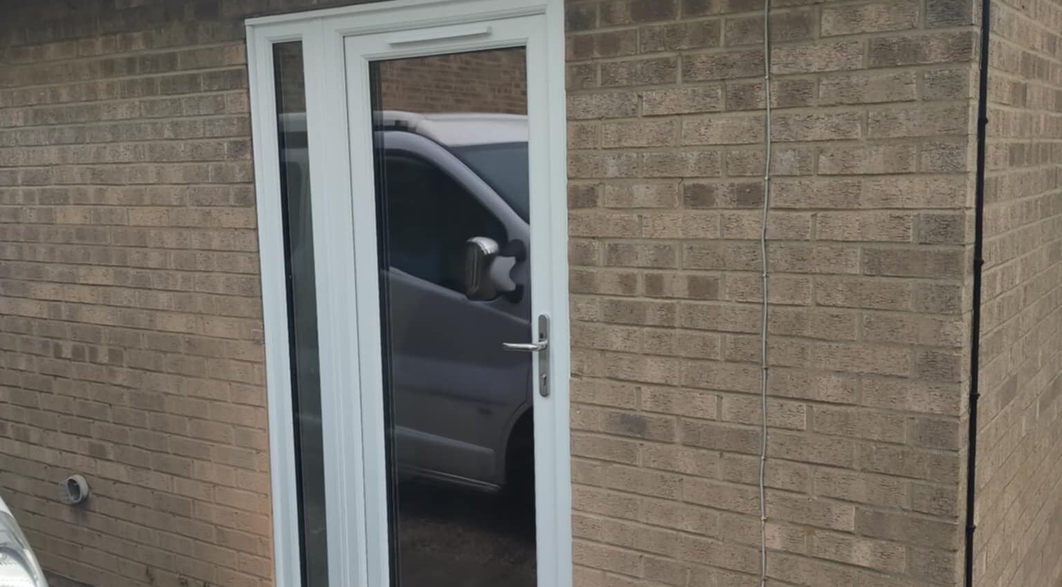Entrance to Beauty by Bex Treatment Room, March, England, GB, showcasing a modern glass door.