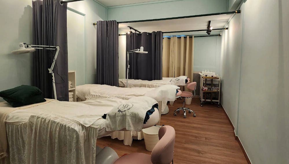 Calm and inviting treatment room at R&R Beauty Studio, Singapore, SG featuring spa beds and soft lighting.