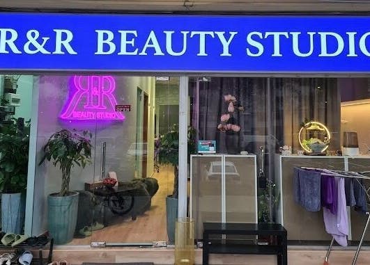 Front view of R&R Beauty Studio, Singapore, showcasing elegant signage and inviting entrance.