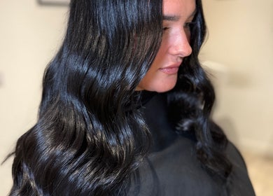 Glossy black waves styled at Millie @ Shade Harrogate, Harrogate, England, GB, showcasing sleek salon expertise.
